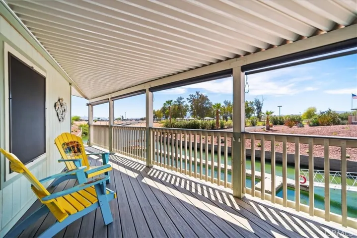 Sit on the porch and enjoy this perfect view of the dock and launch