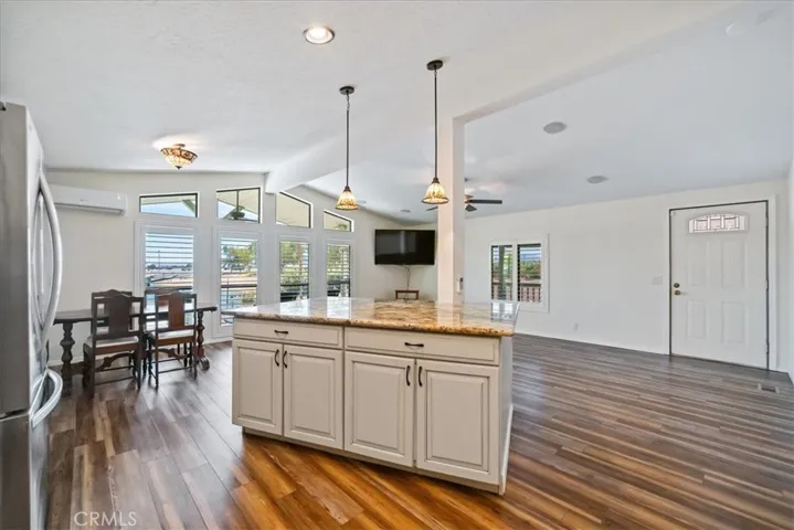 View from kitchen to front door and to the left windows overlooking the boat dock and Jack Smith Park