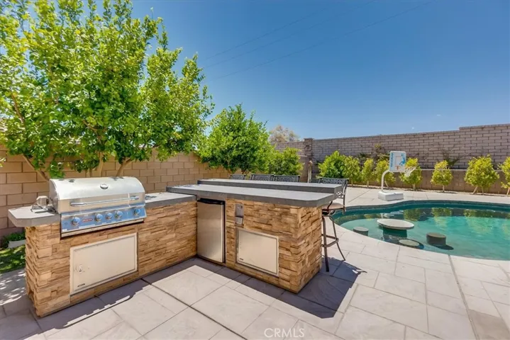 Outdoor kitchen with bar seating