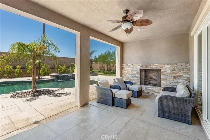 Outdoor fireplace with covered patio