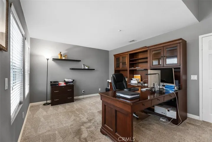 Suite adjacent to primary bedroom, or enclose for 5th bedroom.