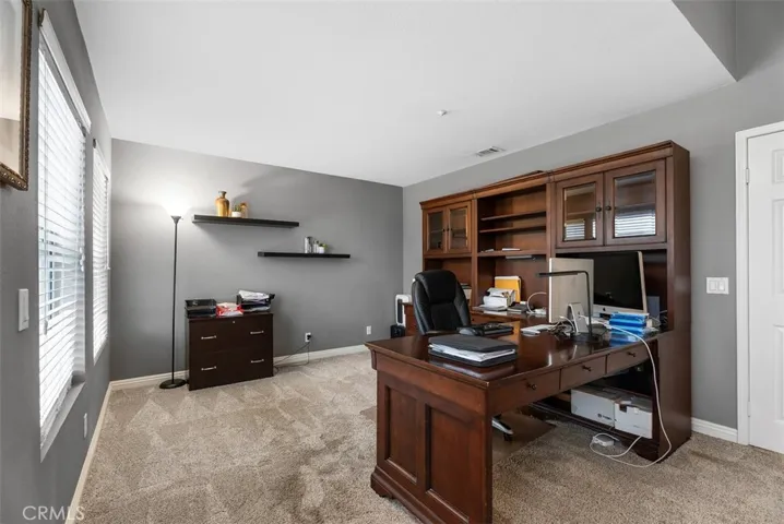 Suite adjacent to primary bedroom, or enclose for 5th bedroom.