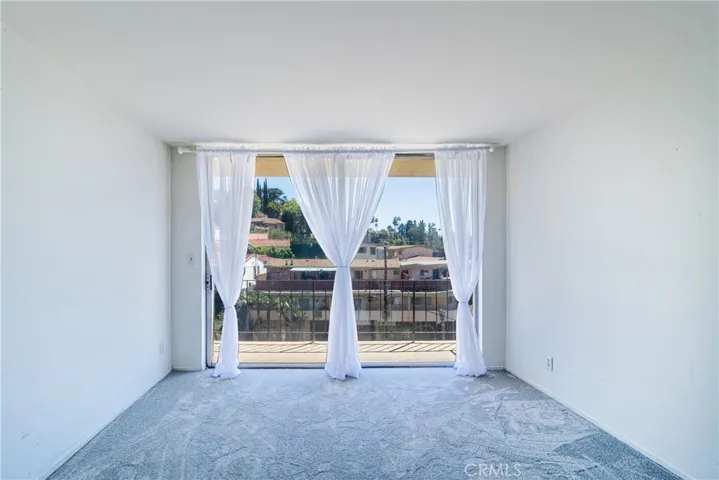 Primary bedroom with hillside views