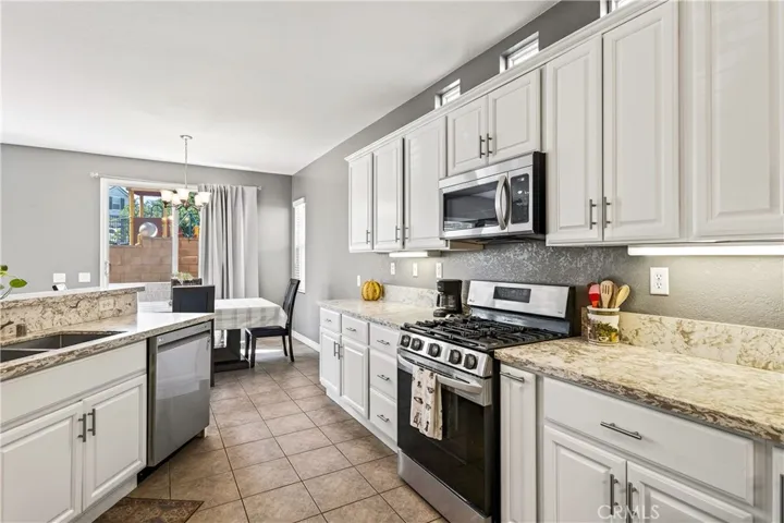 Kitchen opens to dining room 
photo digitally enhanced