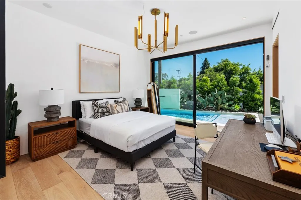 Third bedroom on mail level with effortless access to pool and outdoor fireplace