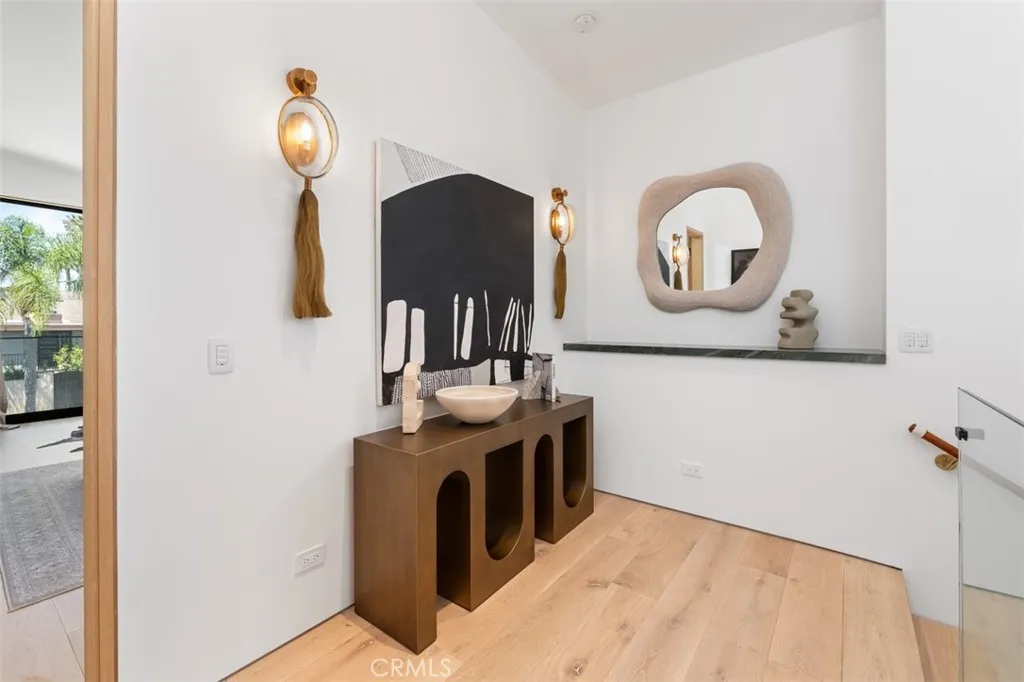 Upstairs hallway with bespoke light fixtures mimic horse tail
