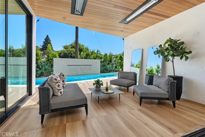 Outdoor patio to enjoy the pool waterfall