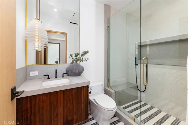 Third en-suite with custom Italian tile and light fixture
