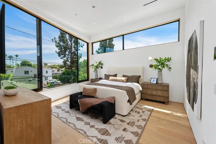 Second primary suite on second level with oversized windows wired for retractable blinds.