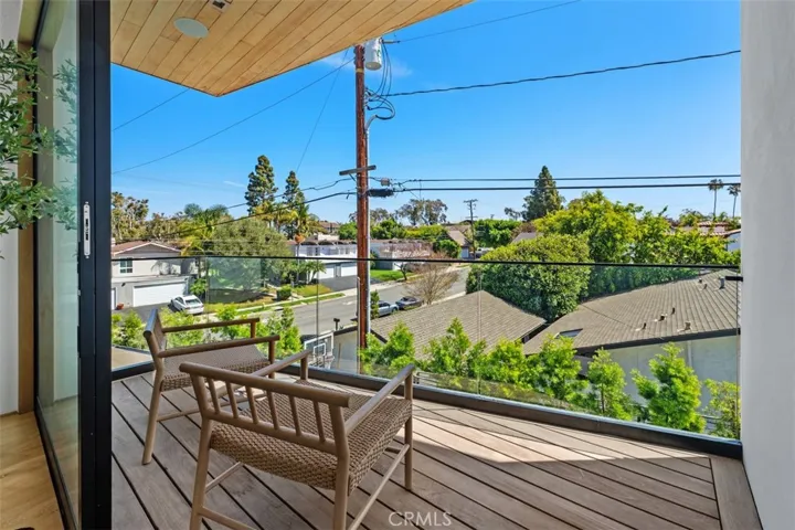 Relaxing balcony off primary suite perfect for enjoying your favorite drink