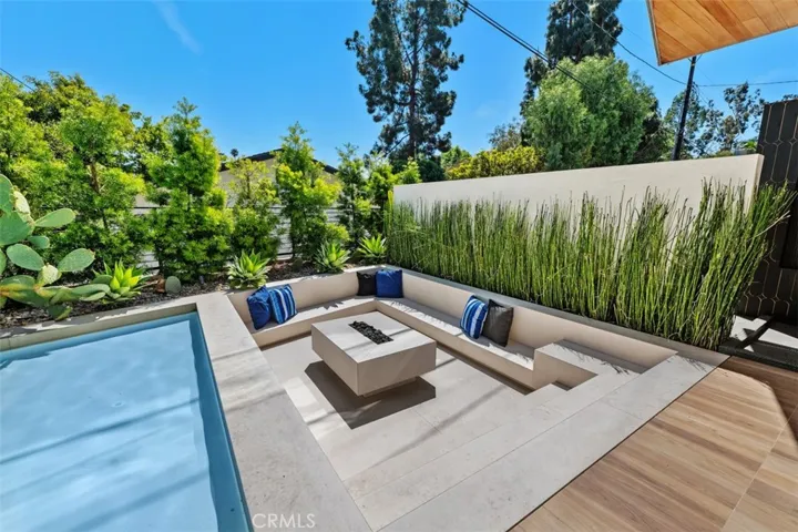 Sunken sitting area with outdoor fireplace