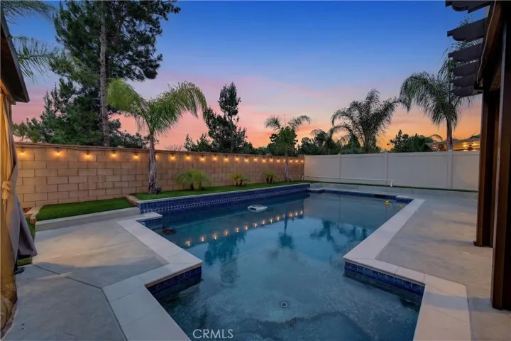 Digitally Enhanced from the original pool pic night pic of pool and backyard.