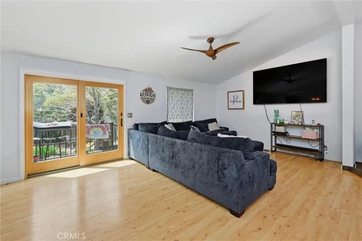 Living room opens to deck and backyard