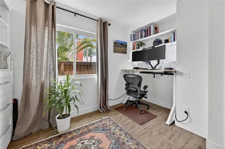 Downstairs Bedroom's closet door removed so it can be used as an office.