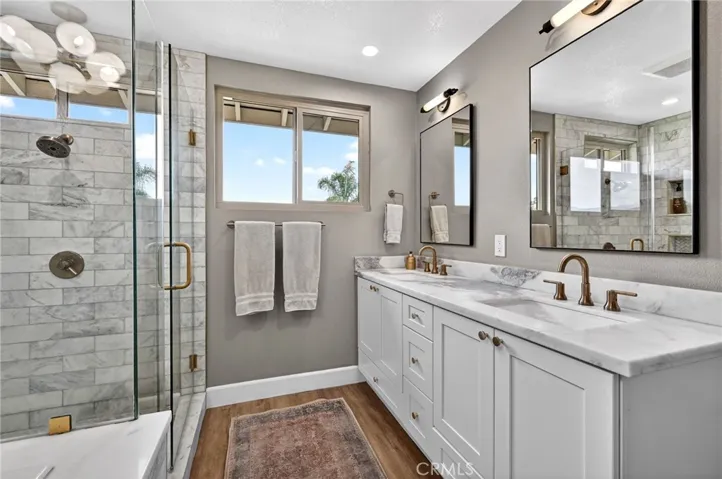 Remodeled Primary Bathroom with 2 sinks and View of the hills