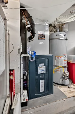 In the garage, there is a newer furnace and water heater