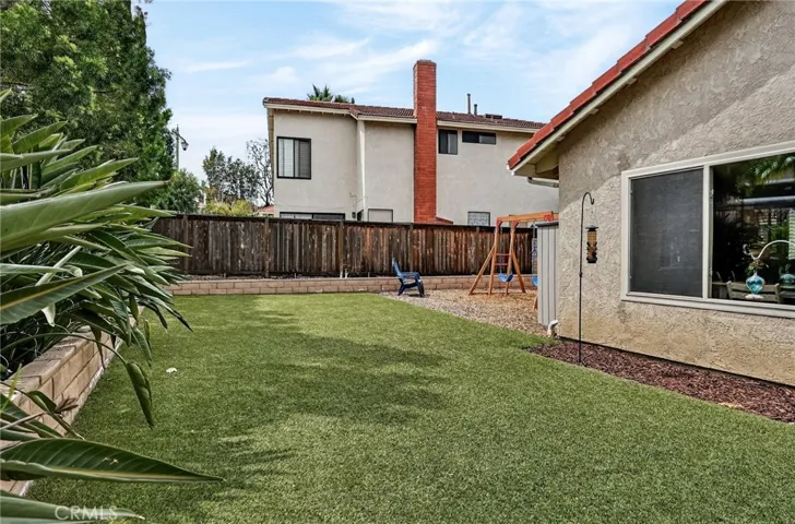 Spacious backyard with turf
