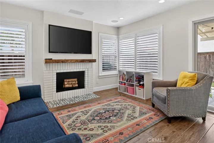 Family room has recessed lighting and ceiling speakers