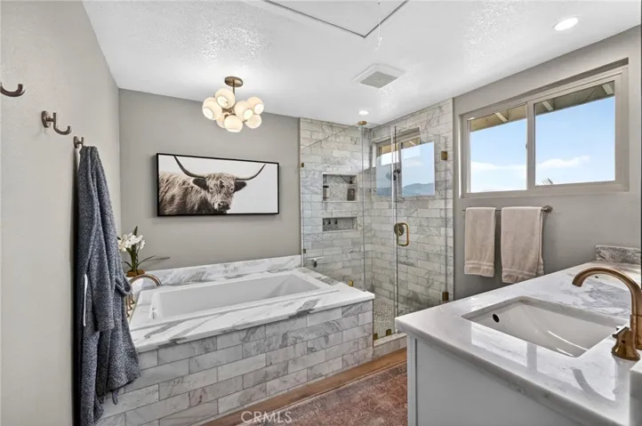 Remodeled Primary Bathroom has a Tub and separate walk in shower