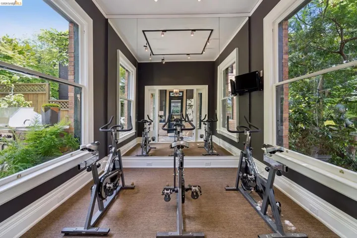 Gym with track lighting and crown molding