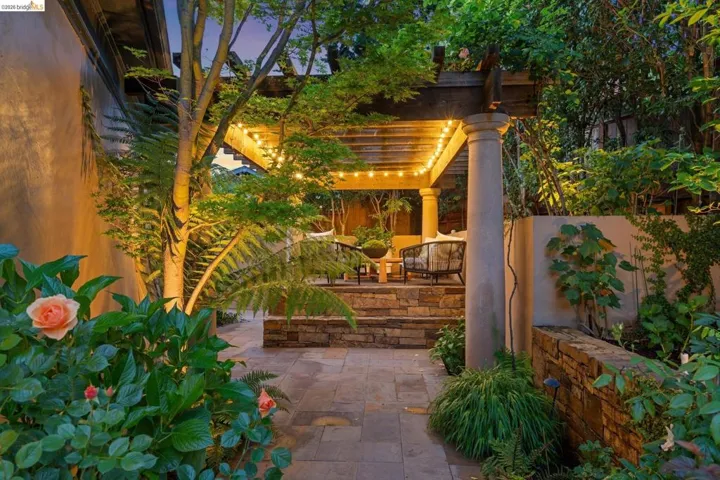 Fenced backyard featuring a patio area and a pergola