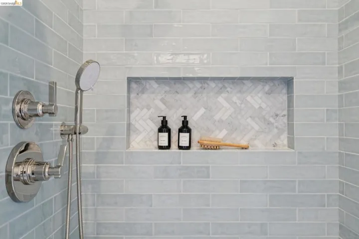 Bathroom view of a tile shower