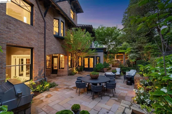 View of patio / terrace featuring french doors, a grill, and outdoor dining space