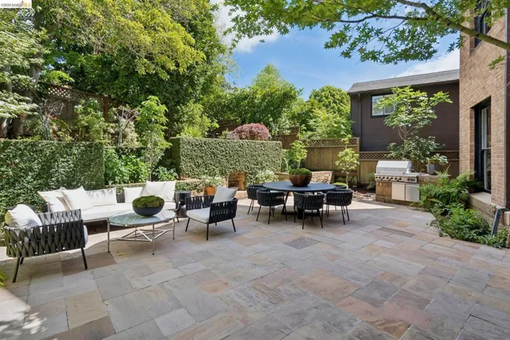 View of patio featuring outdoor lounge area and a grill