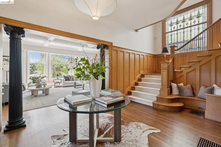 Living room featuring hardwood / wood-style floors and wainscoting