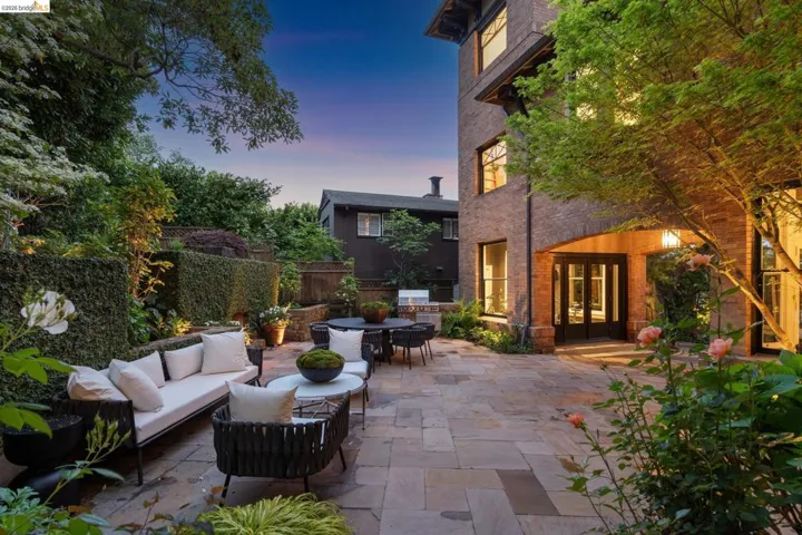 Fenced backyard featuring french doors, a patio, and an outdoor living / dining area