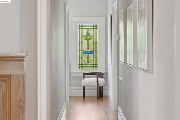 Hall featuring light wood finished floors