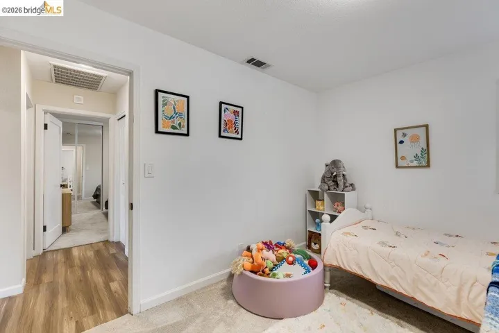 Bedroom with baseboards and light wood-style flooring