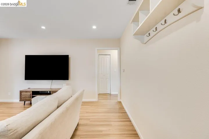 Hall featuring recessed lighting and light wood-style floors