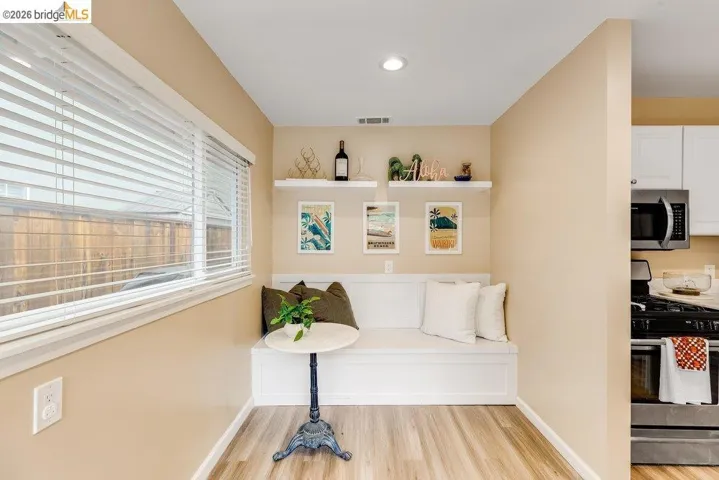 Living area featuring baseboards and light wood finished floors