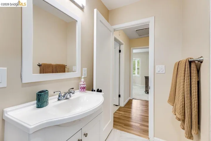 Bathroom featuring vanity and light wood finished floors