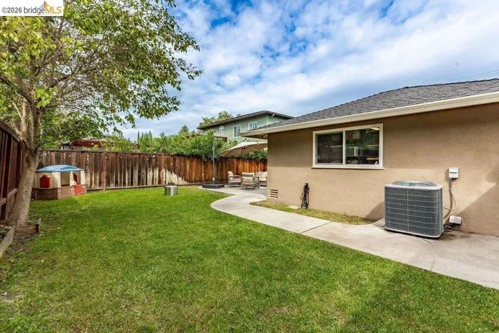 Fenced backyard with a patio area