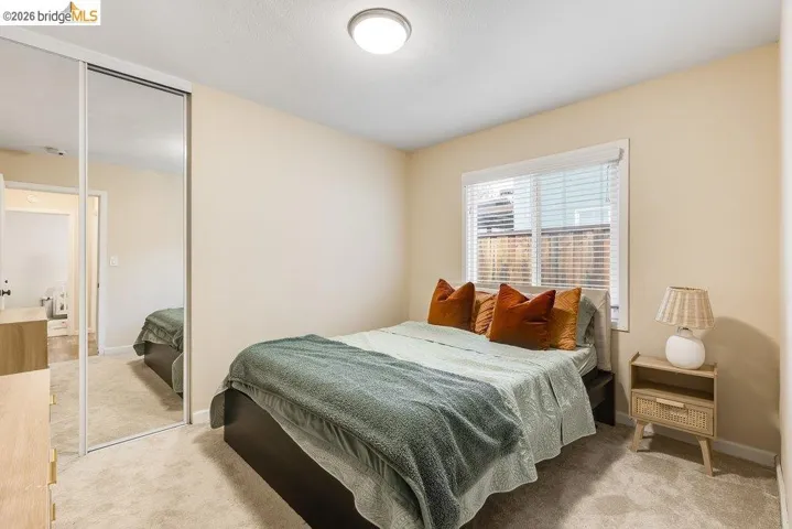 Bedroom featuring a closet and light carpet