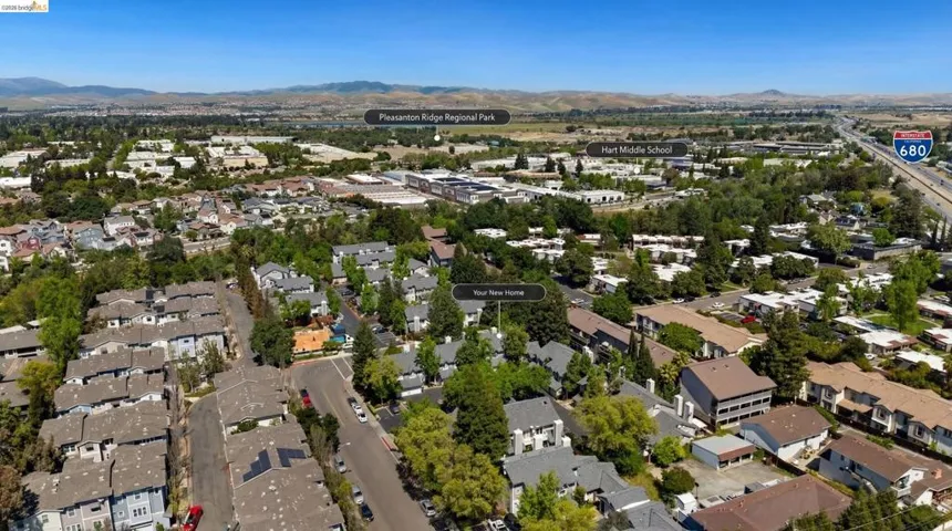 View of property location featuring a mountainous background and nearby suburban area