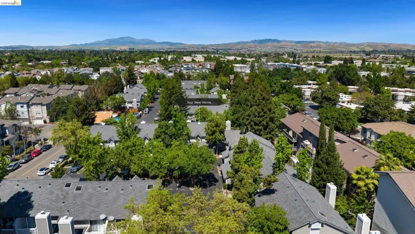 Aerial view of residential area with a mountain backdrop
