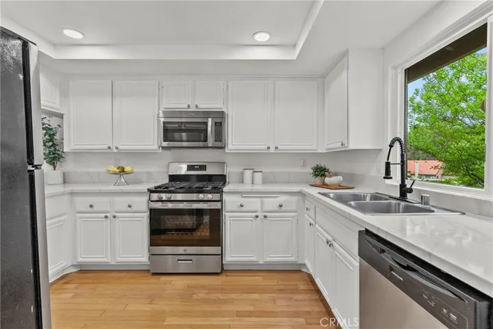 Kitchen with new gas range.