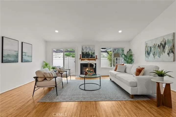 Family room with electric energy efficient fireplace.