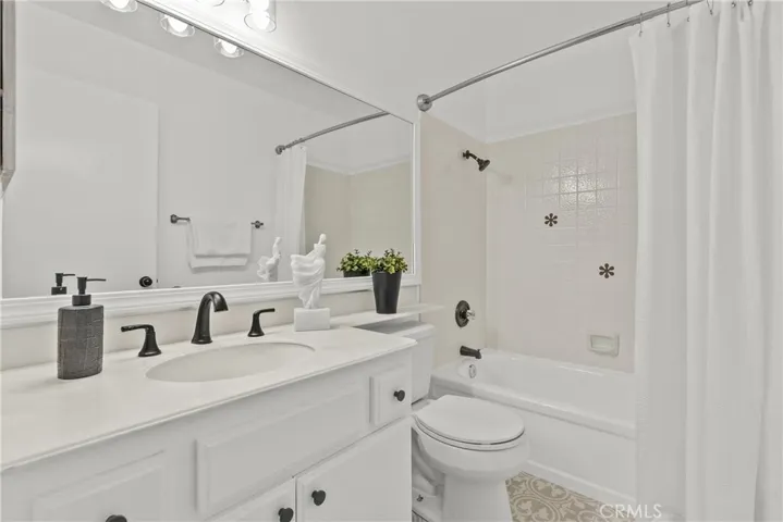 Bathroom with decorative tile.