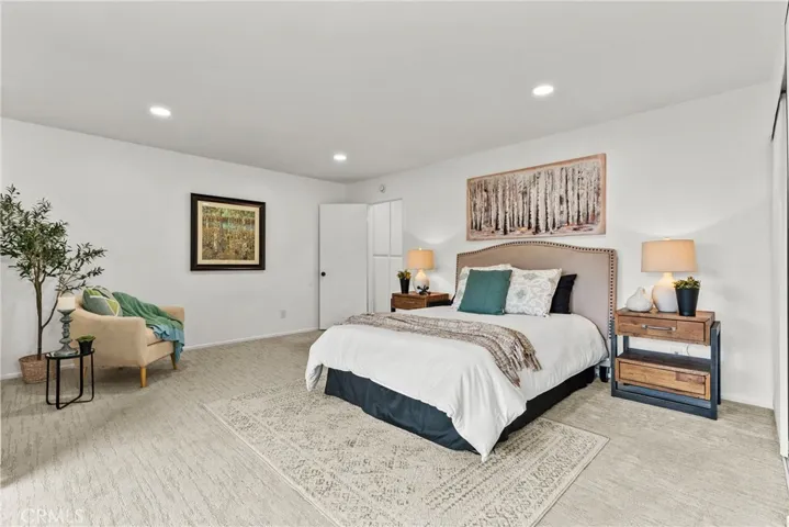 Primary suite with recessed lighting.