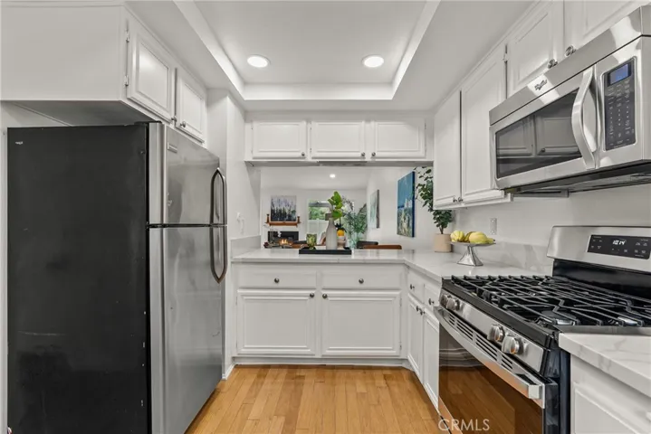Kitchen with recessed lighting.