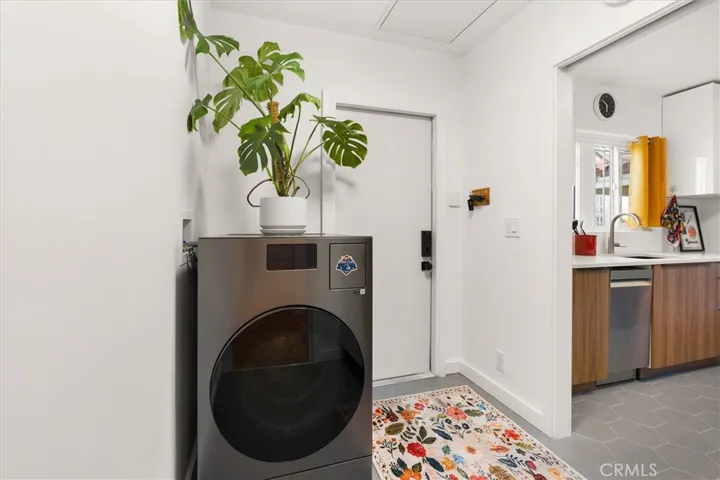 Laundry room w/ door to backyard