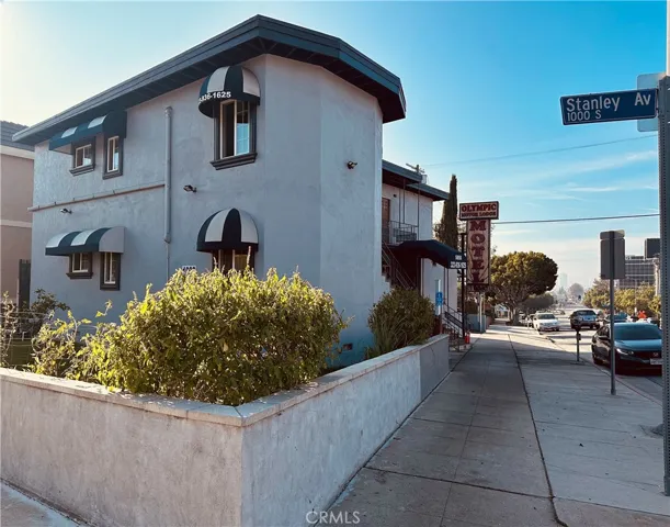 Corner lot, sidewalk view facing west