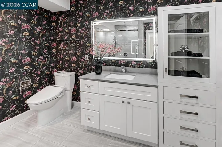 power toilet, lighted mirror and storage