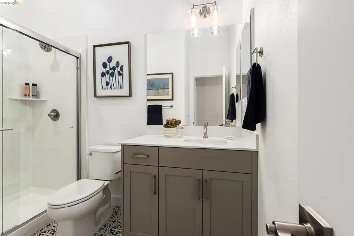Bathroom featuring a stall shower and vanity