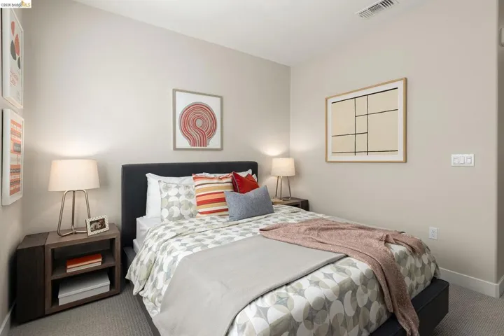 Bedroom featuring carpet floors and baseboards