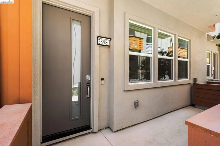 Entrance to property with stucco siding